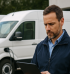 Fleet Manager Reviewing EV Charging Data on Site